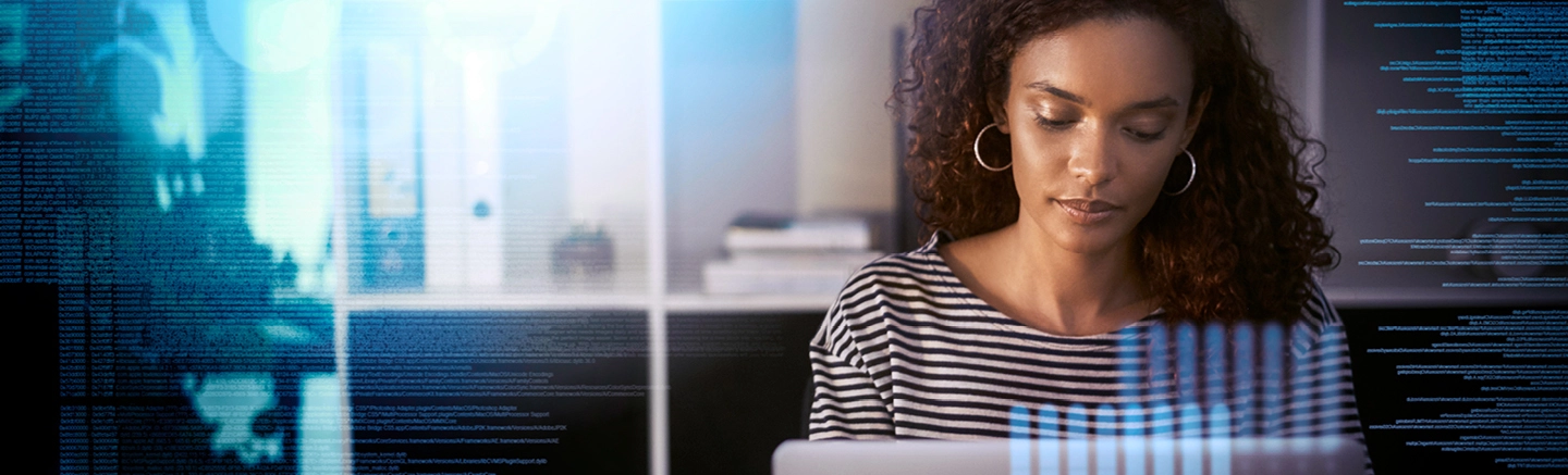 Woman coding on her laptop