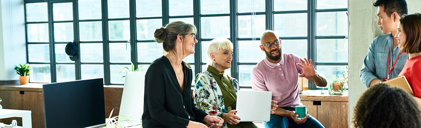 Diverse team discussing a campaign in modern office