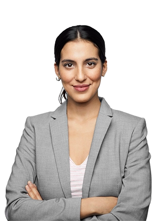 A woman with folded arms, wearing a gray suit jacket, smiles softly.