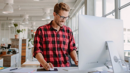 Men in front of a computer.