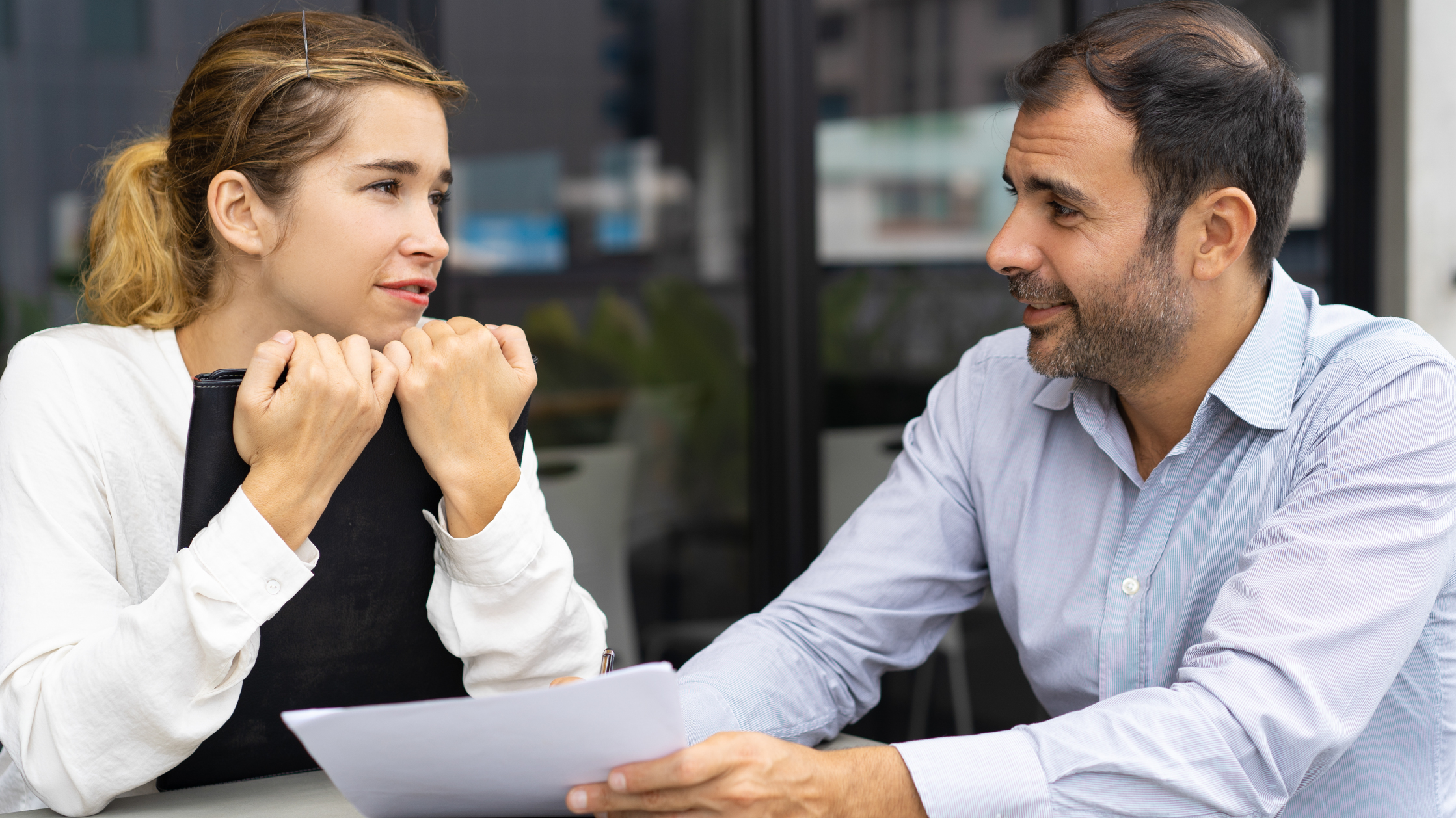 colleagues talking in an office